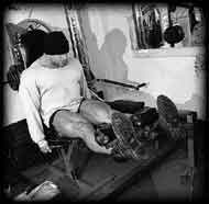 Athlete doing leg extensions.