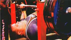 Athlete bench pressing in competition.