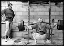 Dave Draper Squating in old school Golds Gym.
