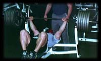 Athlete setting up for a very heavy bench-press!