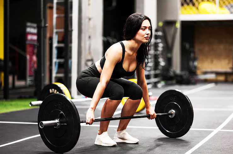 Young girl deadlifting
