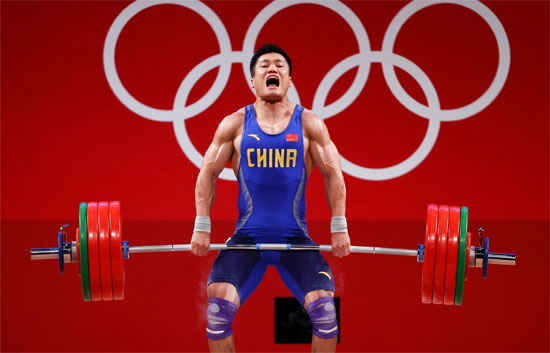 Olympic Lifter in mid clean of a clean & jerk.